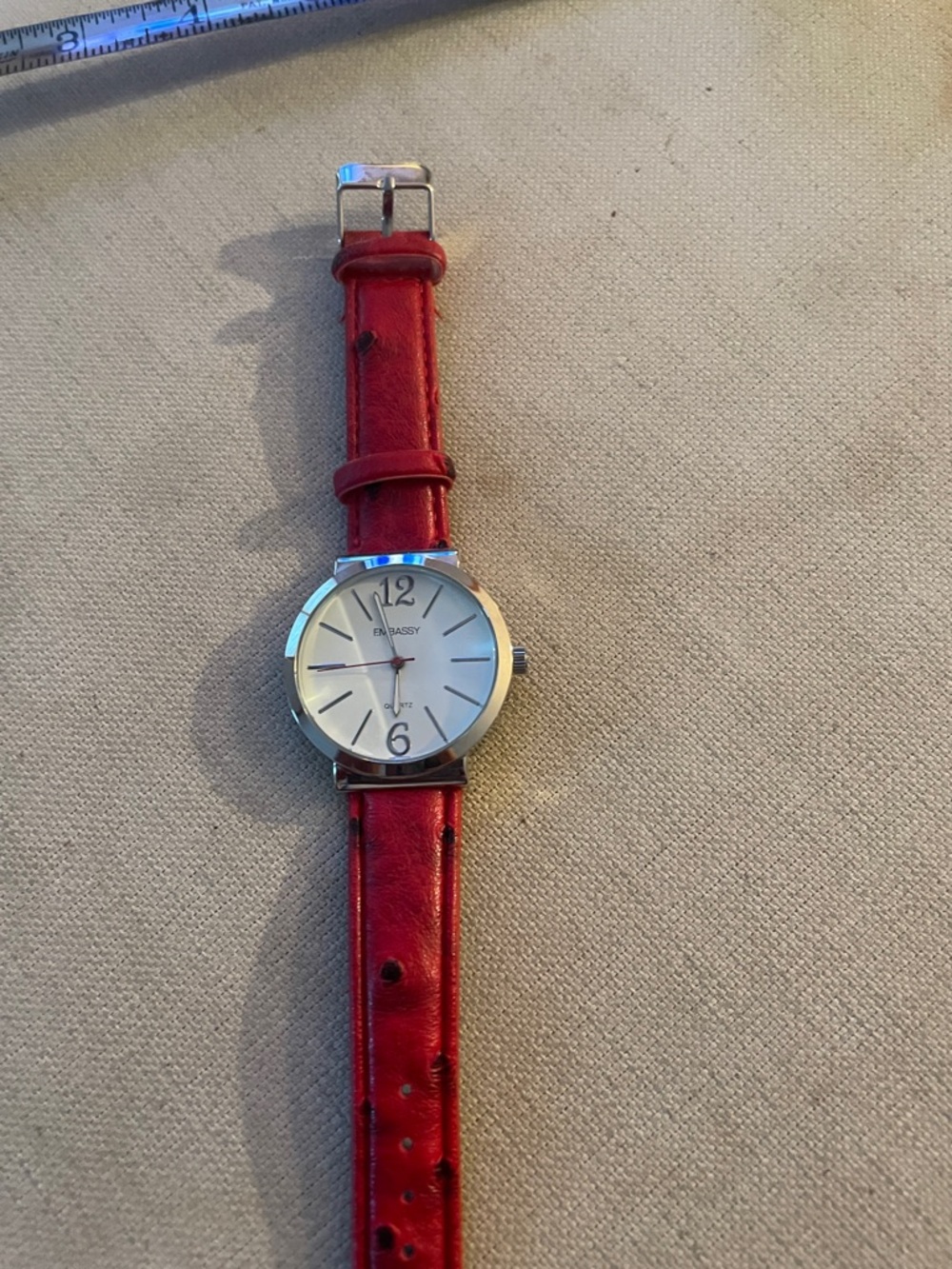 EmBassy women’s Red Leather Strap Watch with Silver Dial needs battery